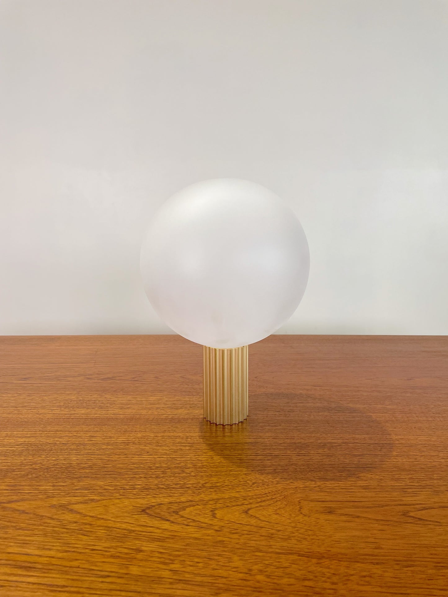 Attelos designer lamp fabricated in Melbourne/Naarm, fluted metal and LED sphere