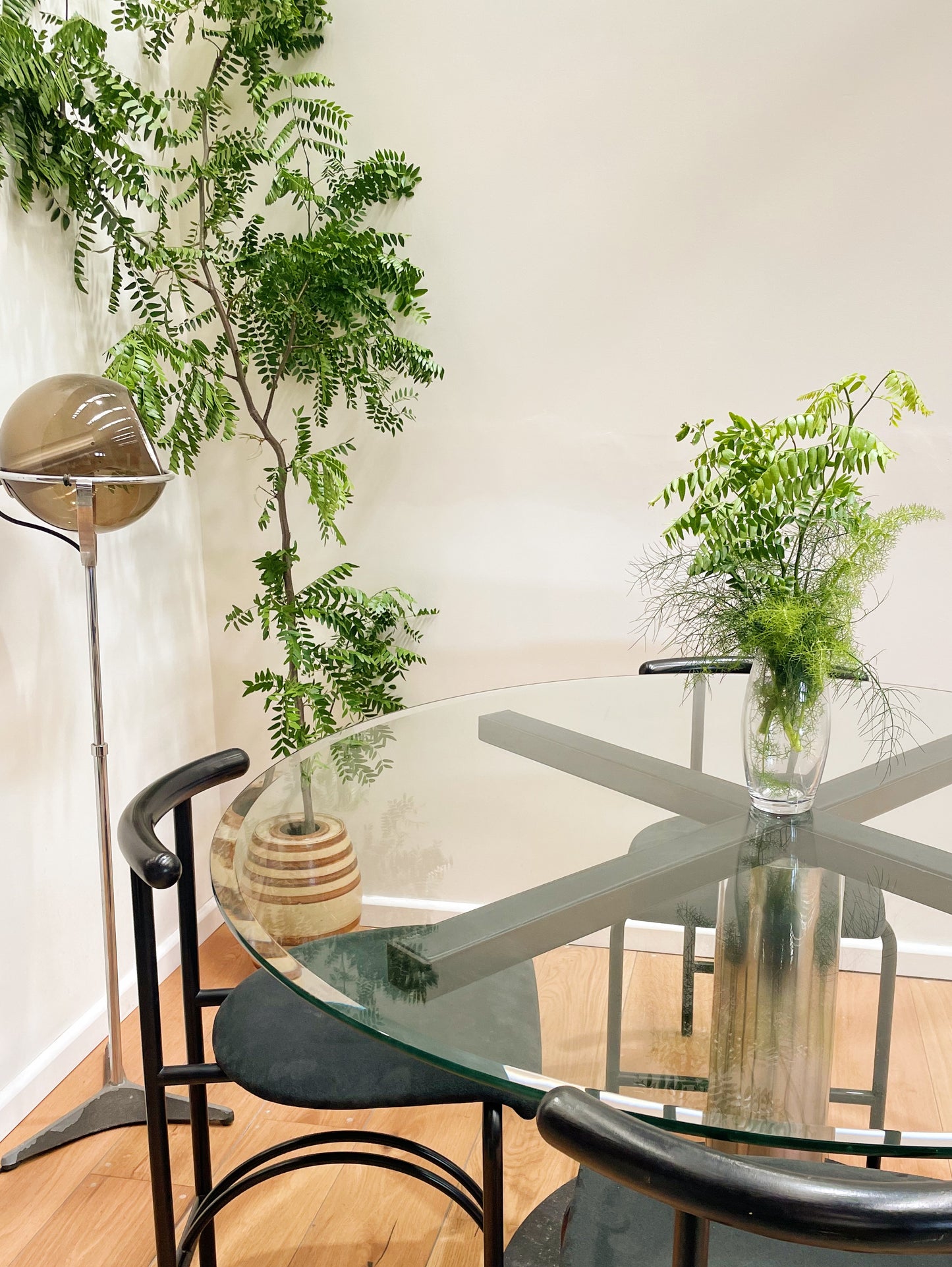 RAAK lamp with Rodney Kinsman Tokyo chairs and Italian glass dining table
