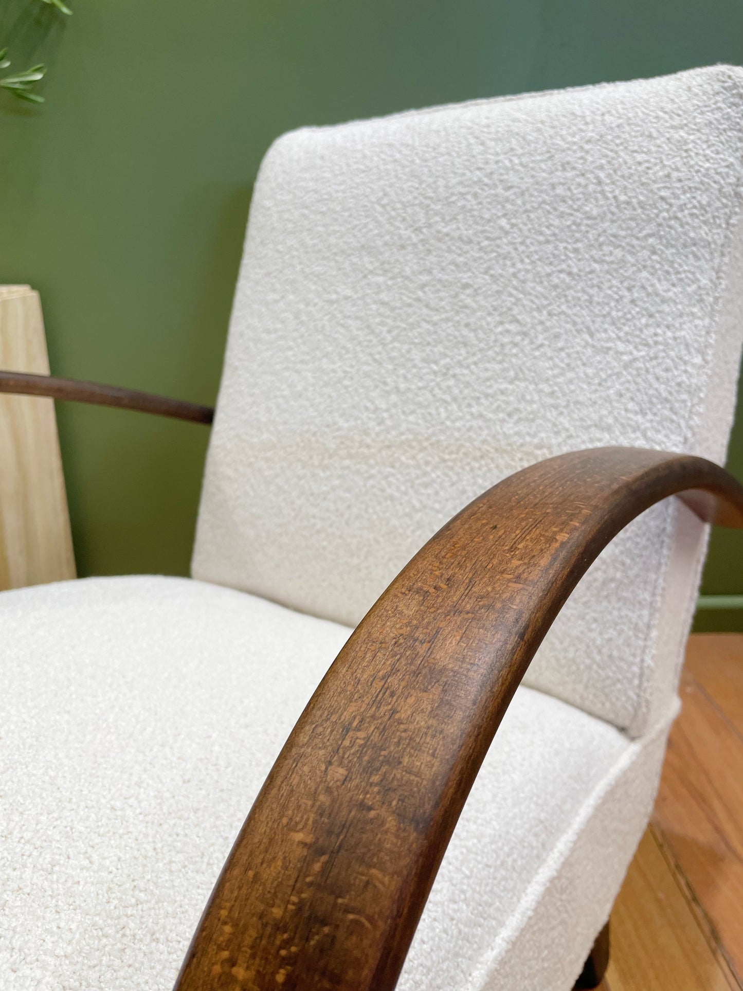 Closeup refinished wood lacquer Halabala chair