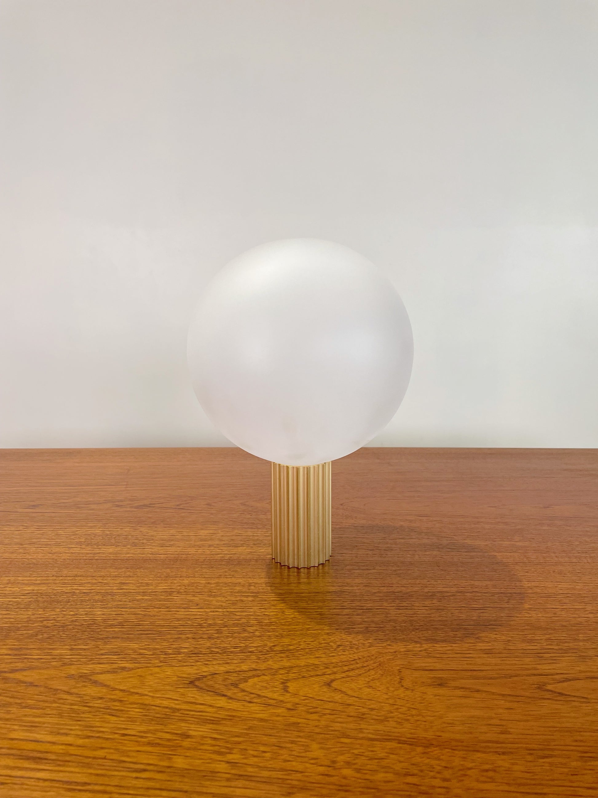 Attelos designer lamp fabricated in Melbourne/Naarm, fluted metal and LED sphere